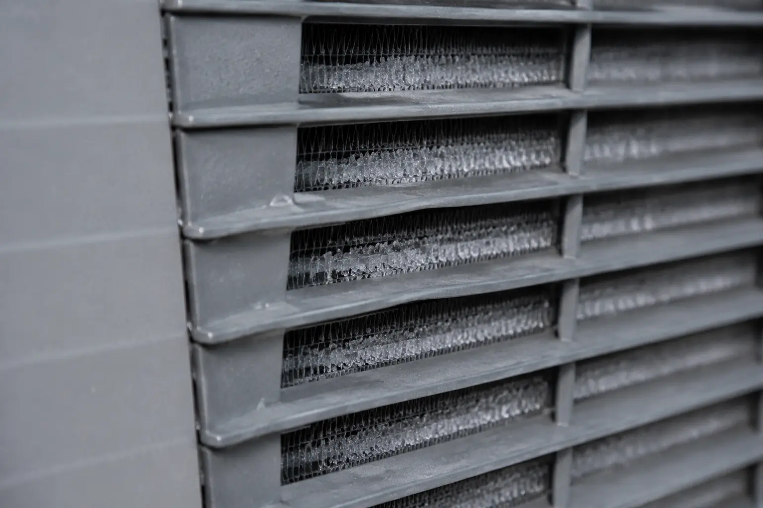 Frost forming between the aluminium coil fins of an air source heat pump