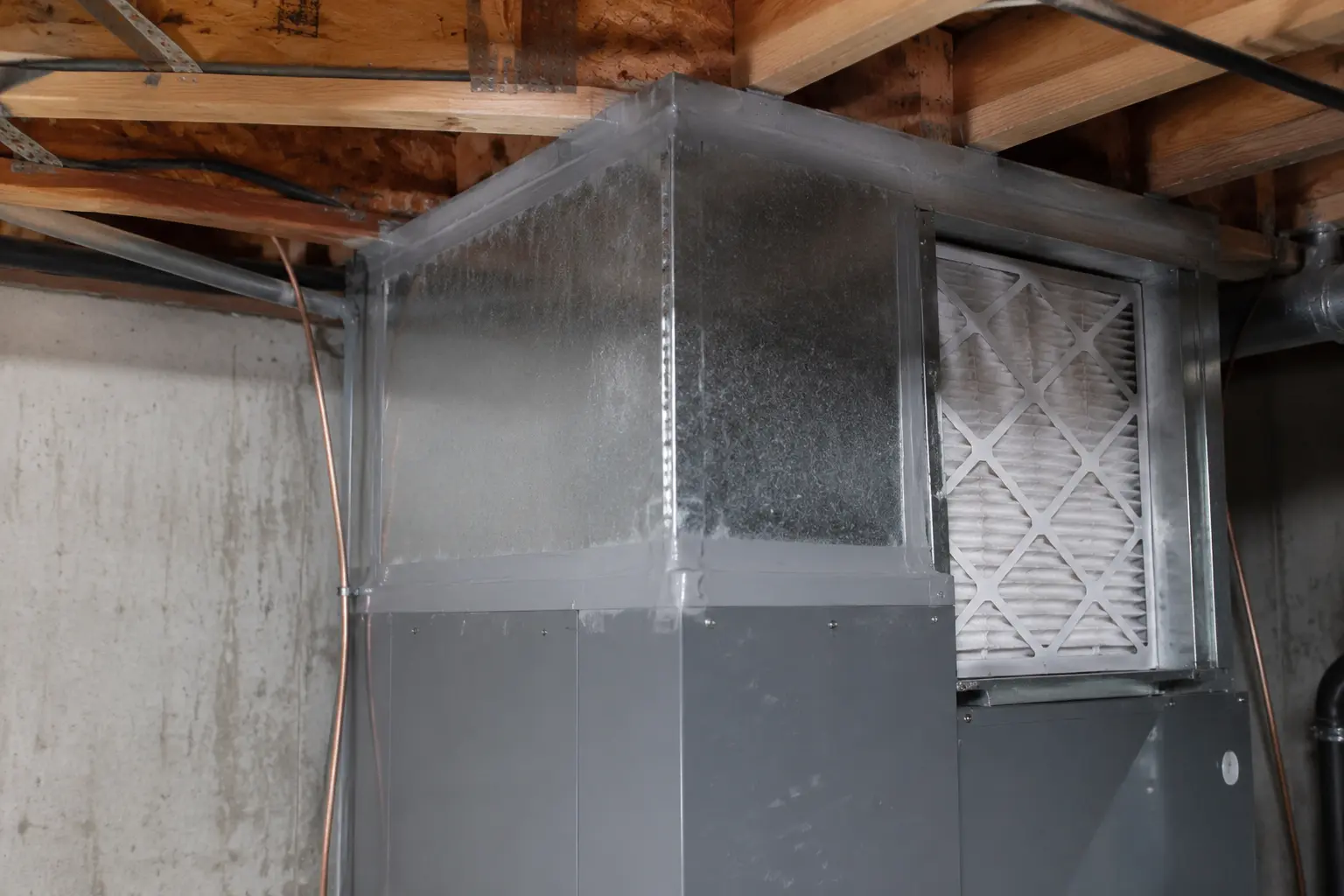 Sealed sheet metal plenum and MERV-13 filter cabinet on a ducted heat pump